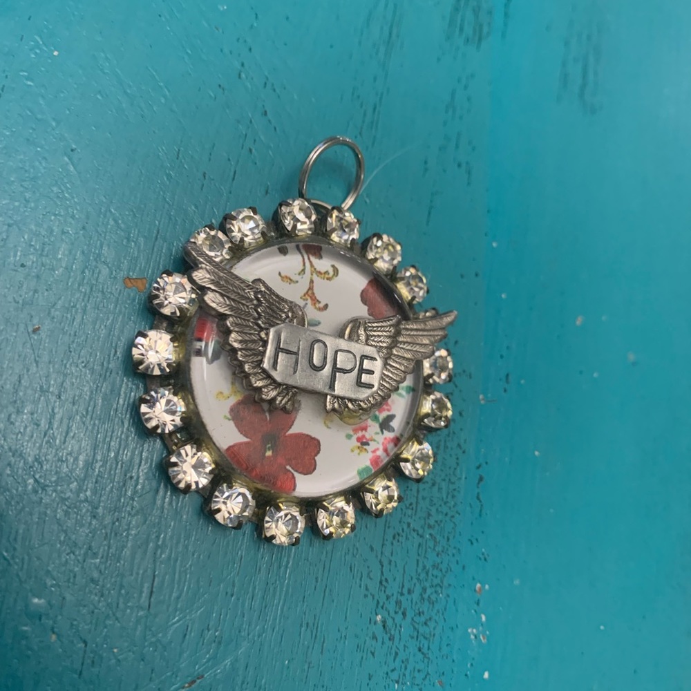 Bling floral winged hand stamped pendant